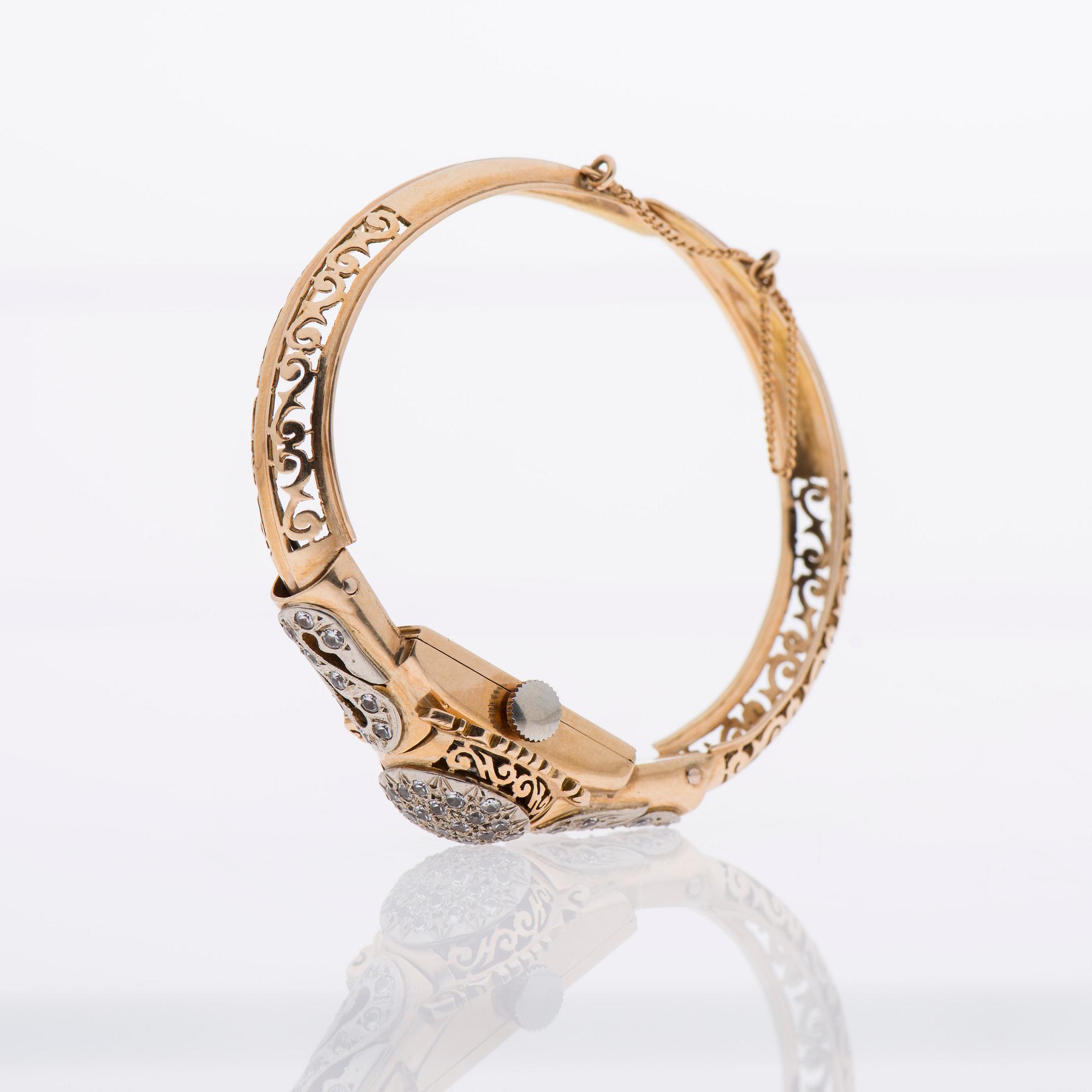 ARMBAND / ARMBANDSUR, 18K guld, åttkantslipade diamanter.