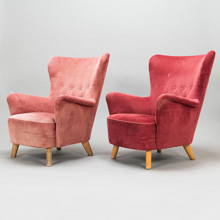 A pair of mid-20th-century armchairs.