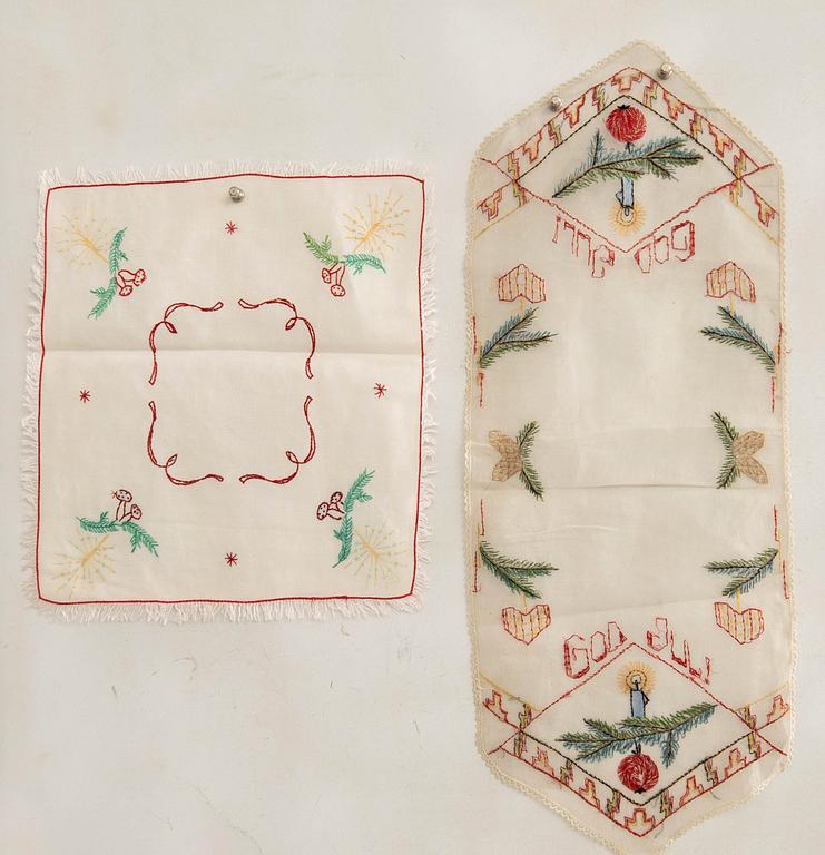 A collection of smaller Christmas tablecloths, runners, and wall hangings, approximately 34 pieces, mid/second half of the 20th century.