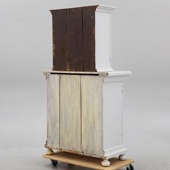 A two-part cabinet, 18th/19th century.