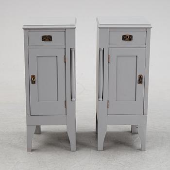 A pair of painted bedside tables stands. First half of the 20th century.