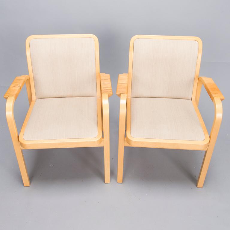 ALVAR AALTO, Pair of model 'E45' armchairs for Artek, late 20th Century.