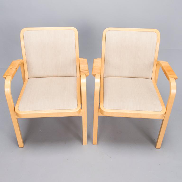 ALVAR AALTO, Pair of model 'E45' armchairs for Artek, late 20th Century.