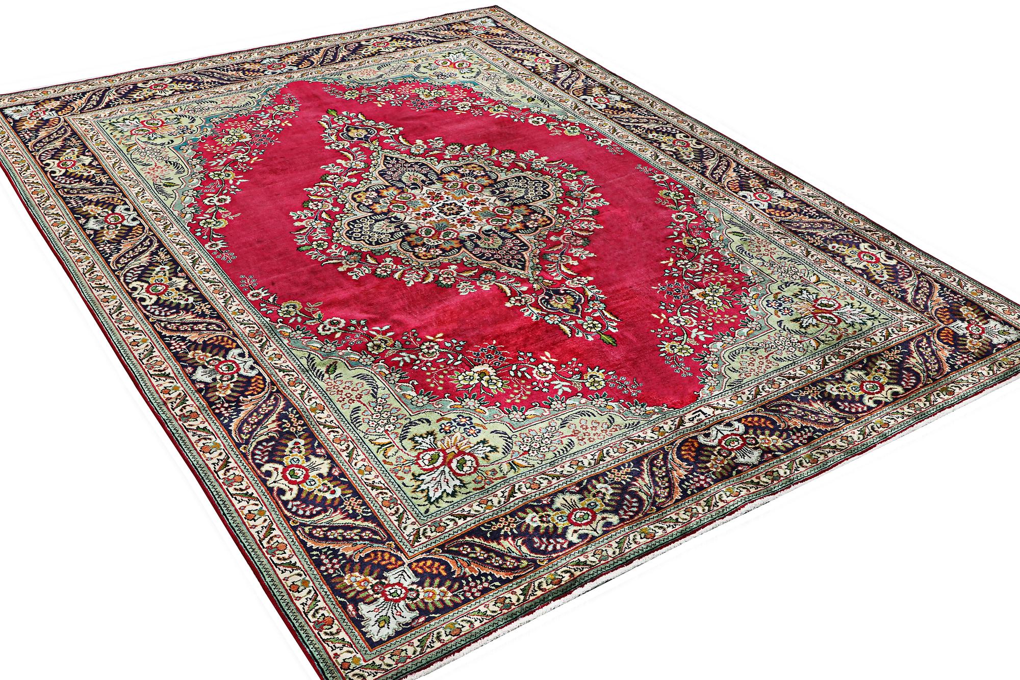 A Tabriz carpet, c. 330 x 250 cm.