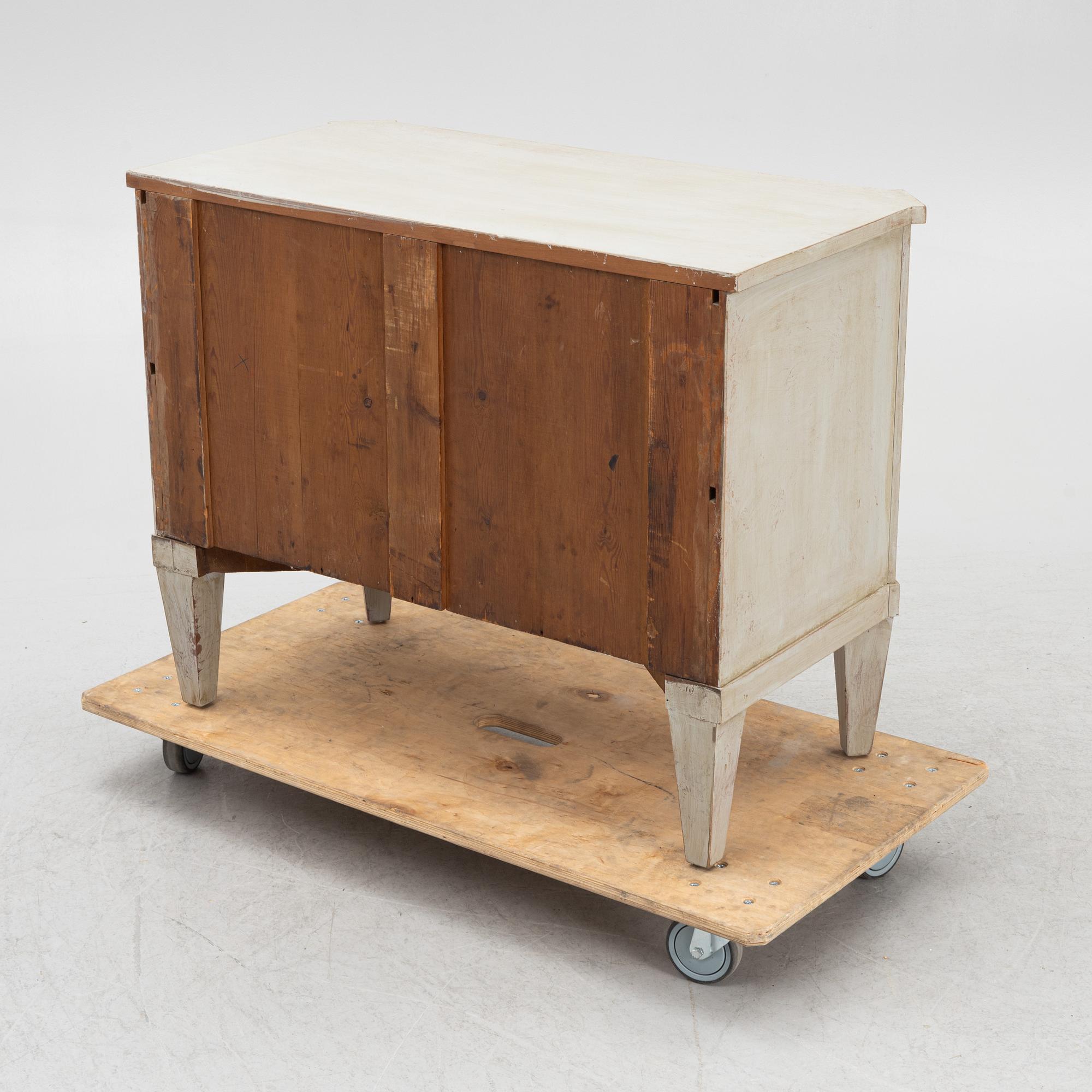 A chest of drawers, circa 1900.