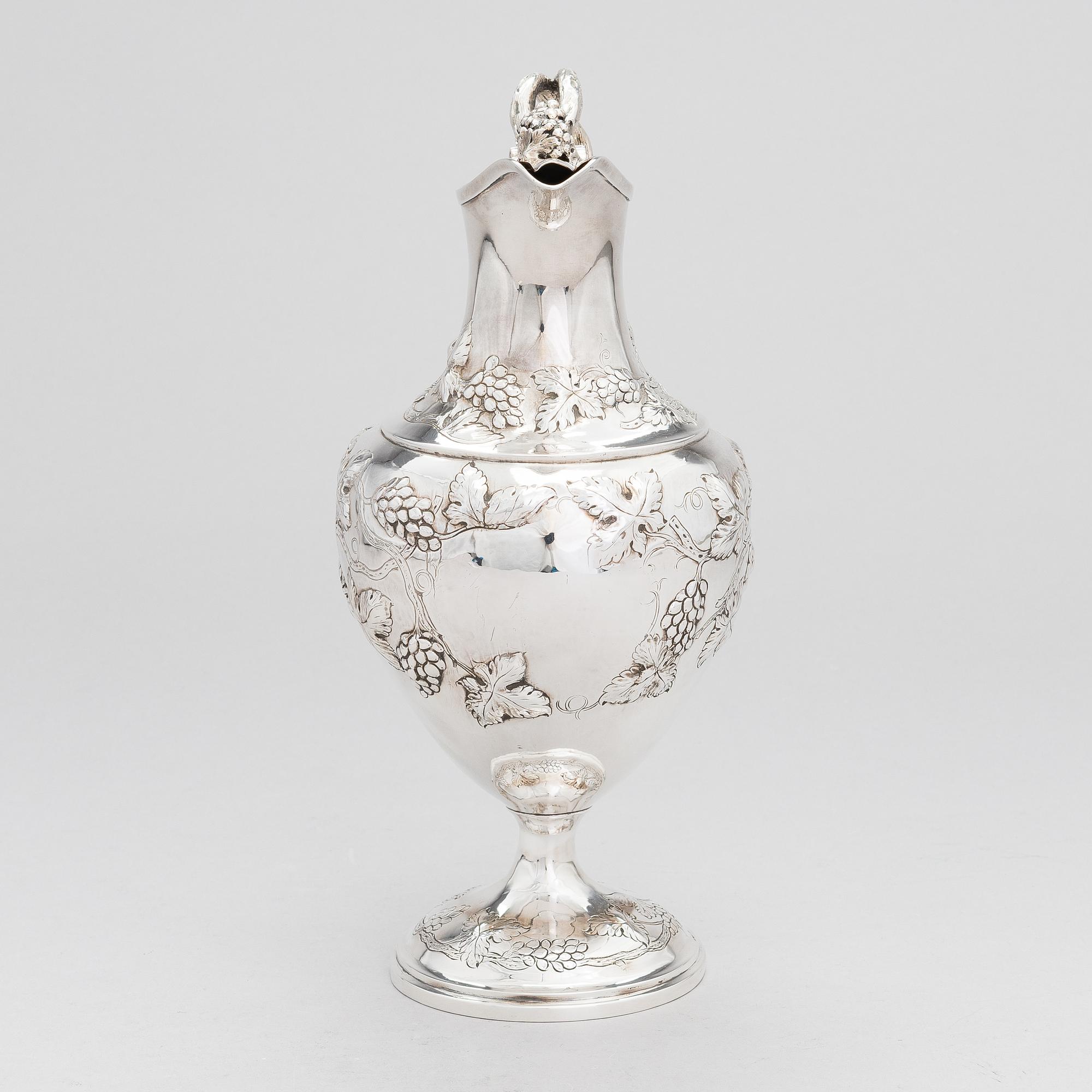 A George III sterling silver ewer by John Scofield, London, 1787.