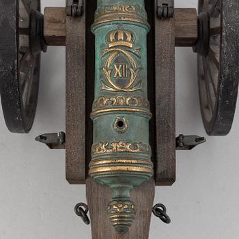 A copy of a field canon with monogram of king  Karl XII produced by Svensk Metallkonst, Carlscrona in late 20th century.