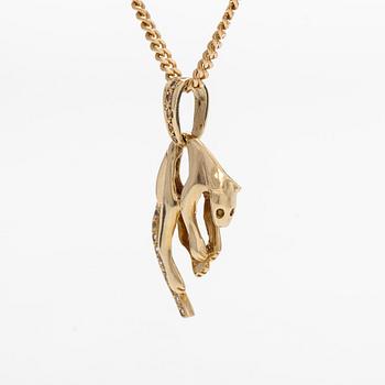 A 14K gold necklace with a panther pendant set with white stones.