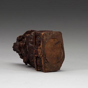 A carved wooden figure on Ganesha on a throne, Nepal, 19th Century or older.