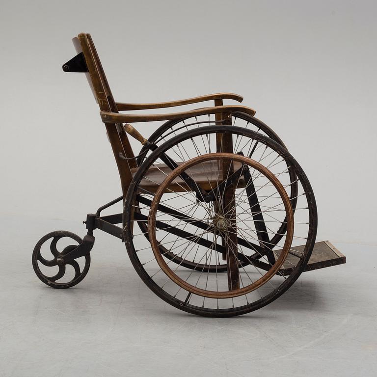 An early 20th century wheel chair.