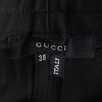 Gucci, a pair of black pants, size 38.