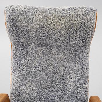 Jan Ekström, armchair with footstool "Gazelle", Conform, 21st century.