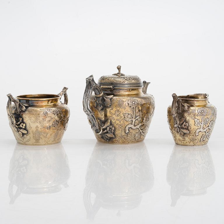 A 9-piece parcel-gilt sterling silver tea set, maker's mark of Samuel Smily, Goldsmiths Alliance Ltd, London 1873-74.