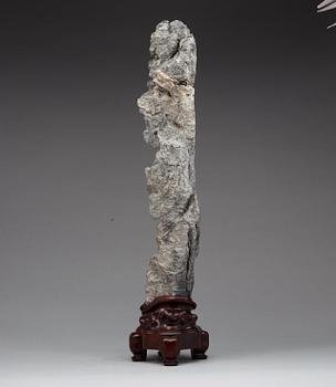 A Chinese scholars rock with a wooden stand, 20th Century.