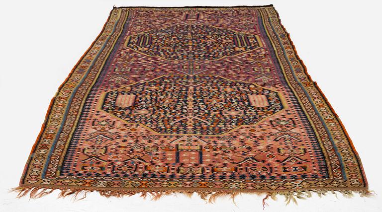 An antique kilim, southeastern Anatolia/Caucasus, c. 398 x 176 cm.