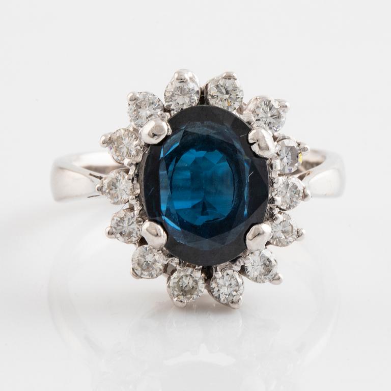 Dark sapphire and brilliant cut diamond ring.