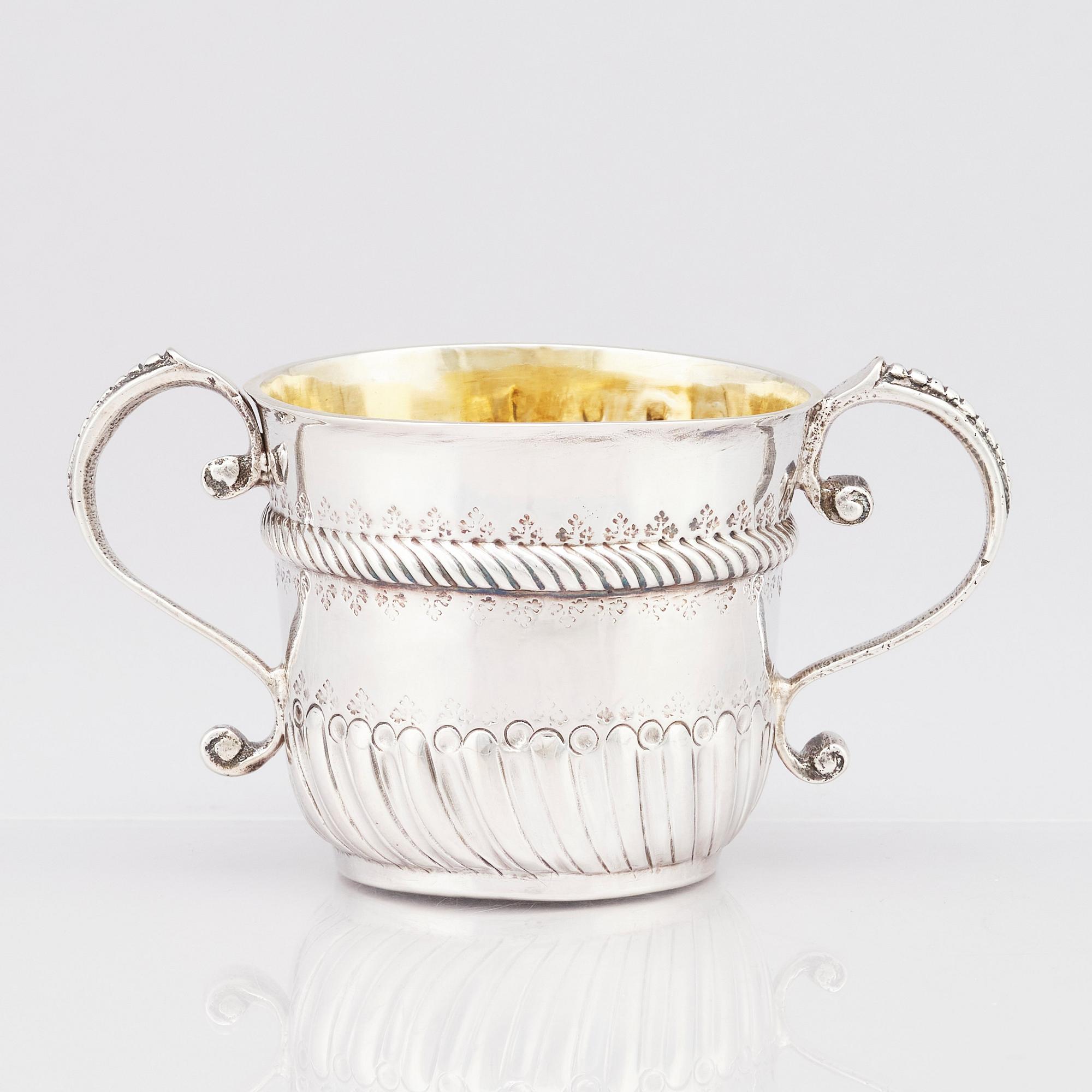 An English late 17th Century silver porringer, marks if William Andrews, London 1697-98.