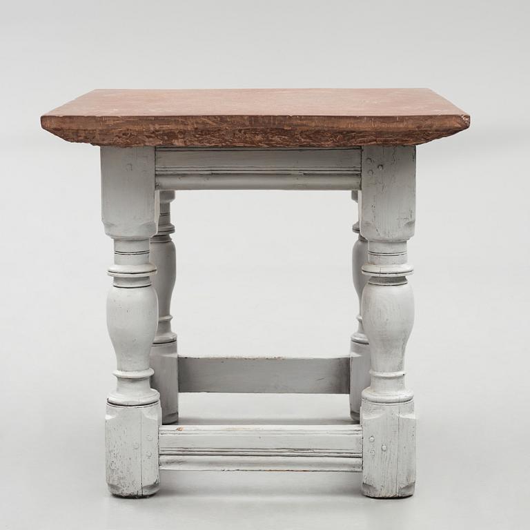 A limestone-top table, Sweden, 18th century.