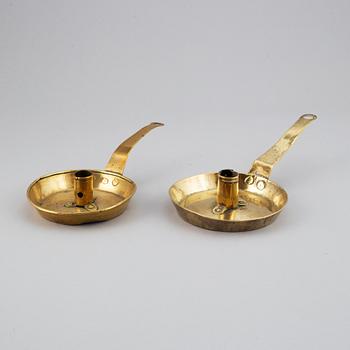 Four 18th century brass night light holders.