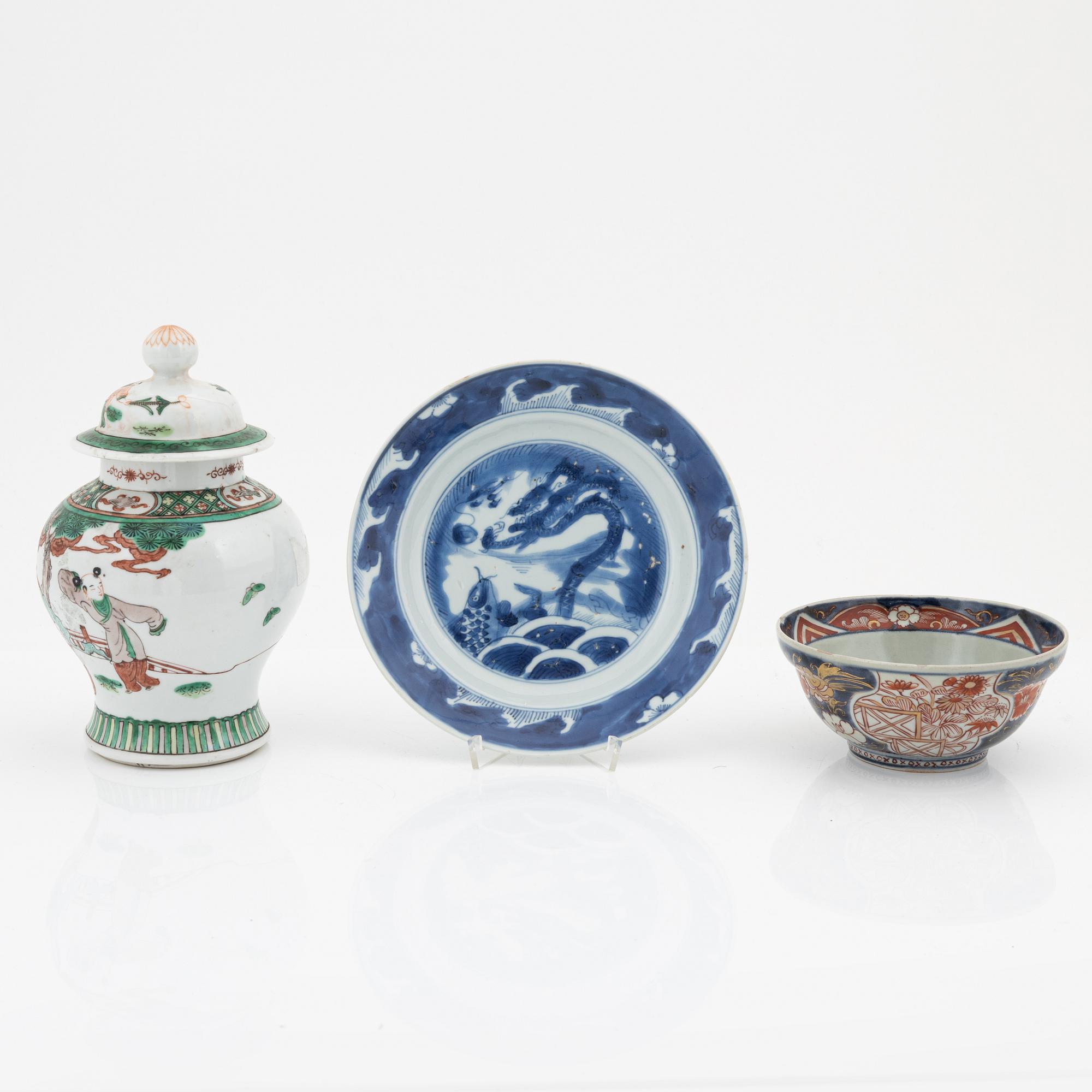 A Chinese dinner plate and a Japanese imari bowl, 18th Century together with a Chinese 19th Century jar with cover.