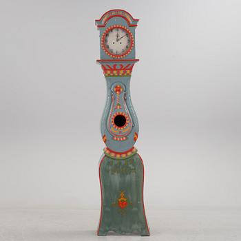 a painted grandfather-clock from the first half of the 19th century.