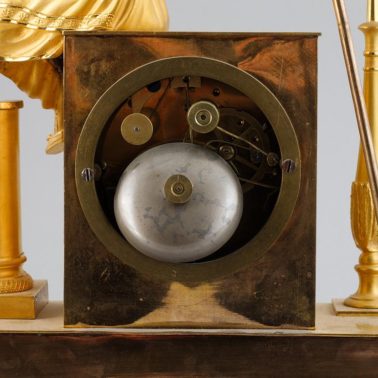 A French Empire gilt bronze mantel clock, early 19th Century.