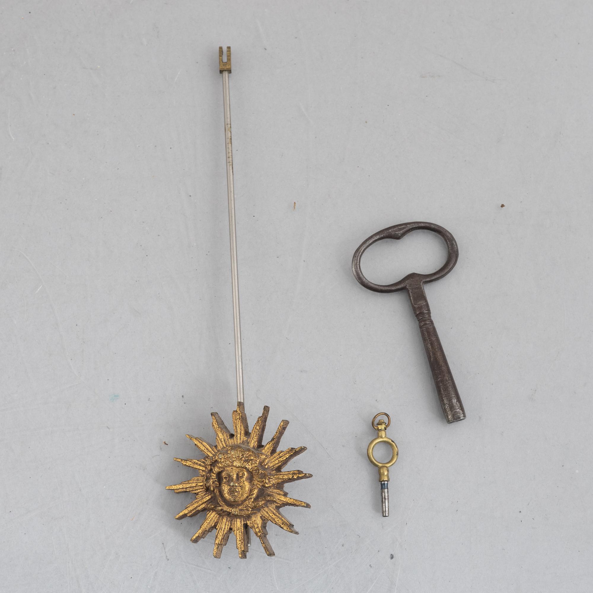 A Louis XVI-style mantel clock Paris, France and a pair of candelabras, late 19th century.