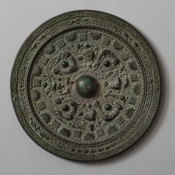 Two bronze mirrors, Six dynasties (220-589) and Tang dynasty (618-907).