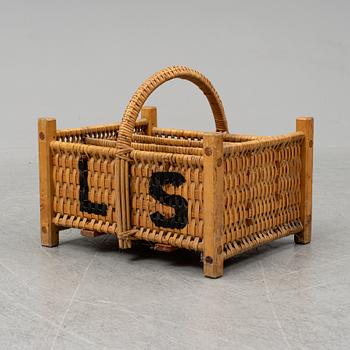 A rattan bottle basket.