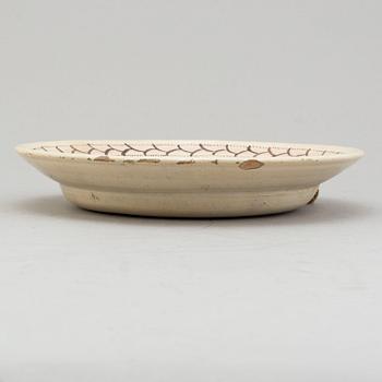 An faience dish dated 1816.
