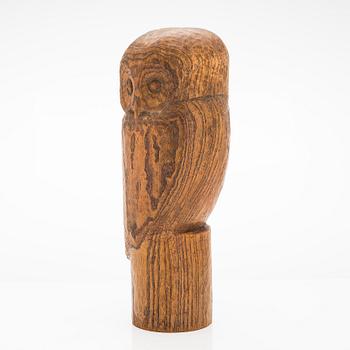 Gunnar Uotila, a wooden sculpture signed -56-.