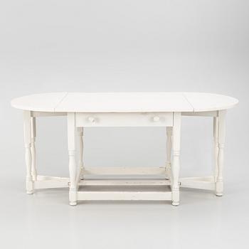 An early 20th century drop-leaf table.