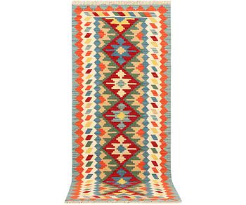 An Afghan kilim runner, c. 200 x 80 cm.
