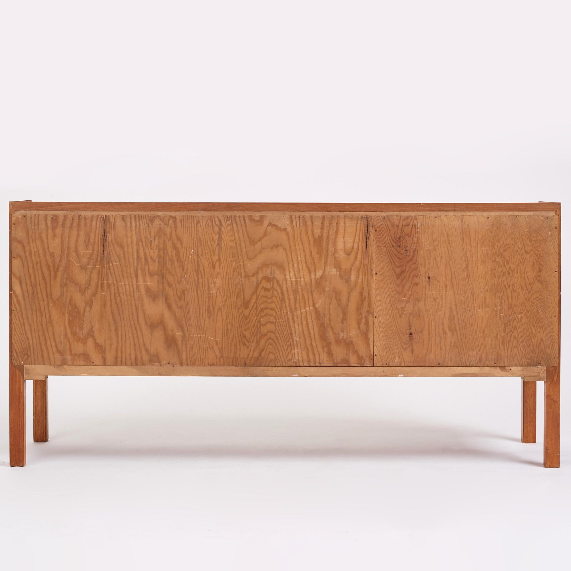 Axel Bäck, a Swedish Modern mahogany veneered sideboard, Eksjö Möbelfabrik, Sweden 1950, signed.
