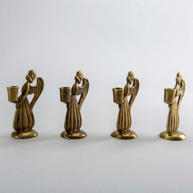 Four second half of the 20th century brass CANDLESTICKS.
