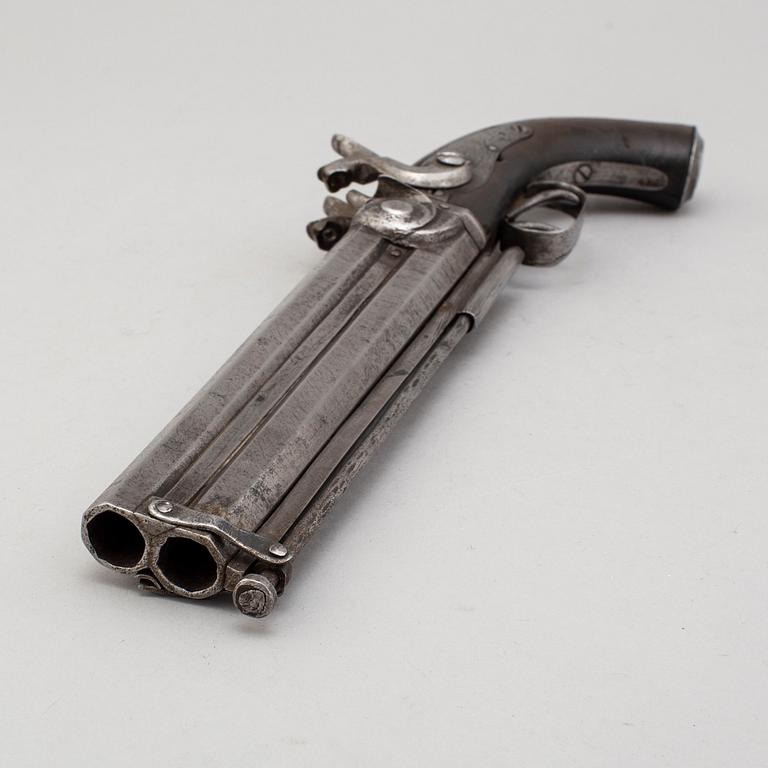 A second part of the 19th century double barreled over-and-under percussion pistol.