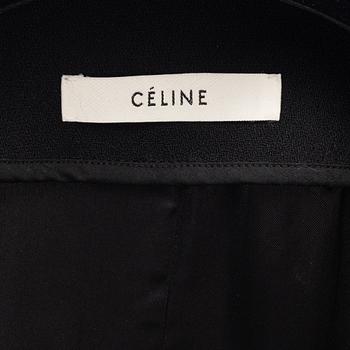 Céline, a black wool and fur coat, size 34.