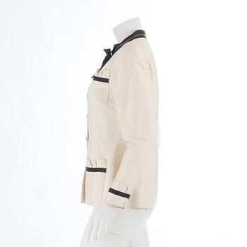 CHANEL, a black and white silk jacket.