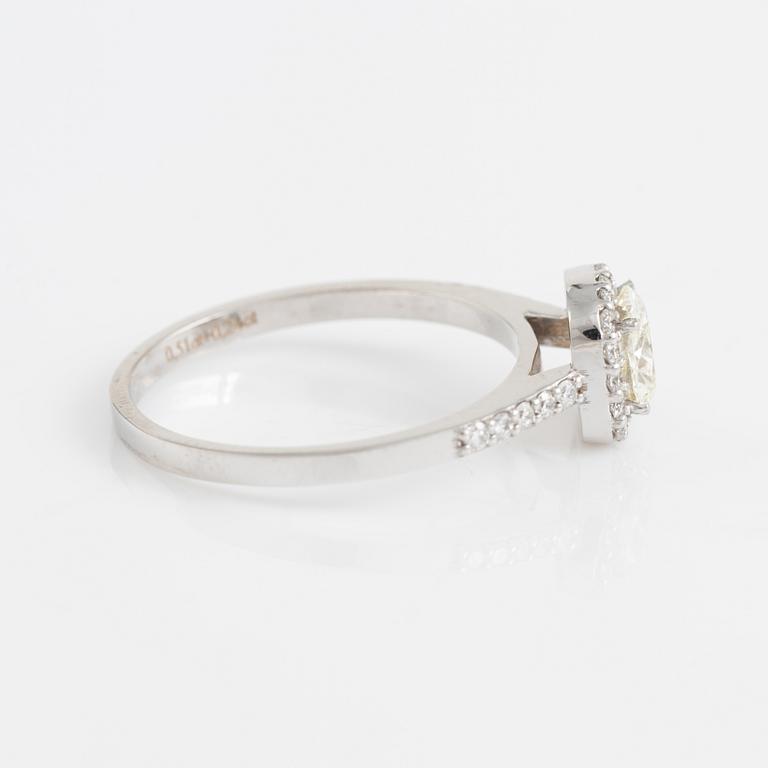 Cushion cut diamond and brilliant cut diamond ring.