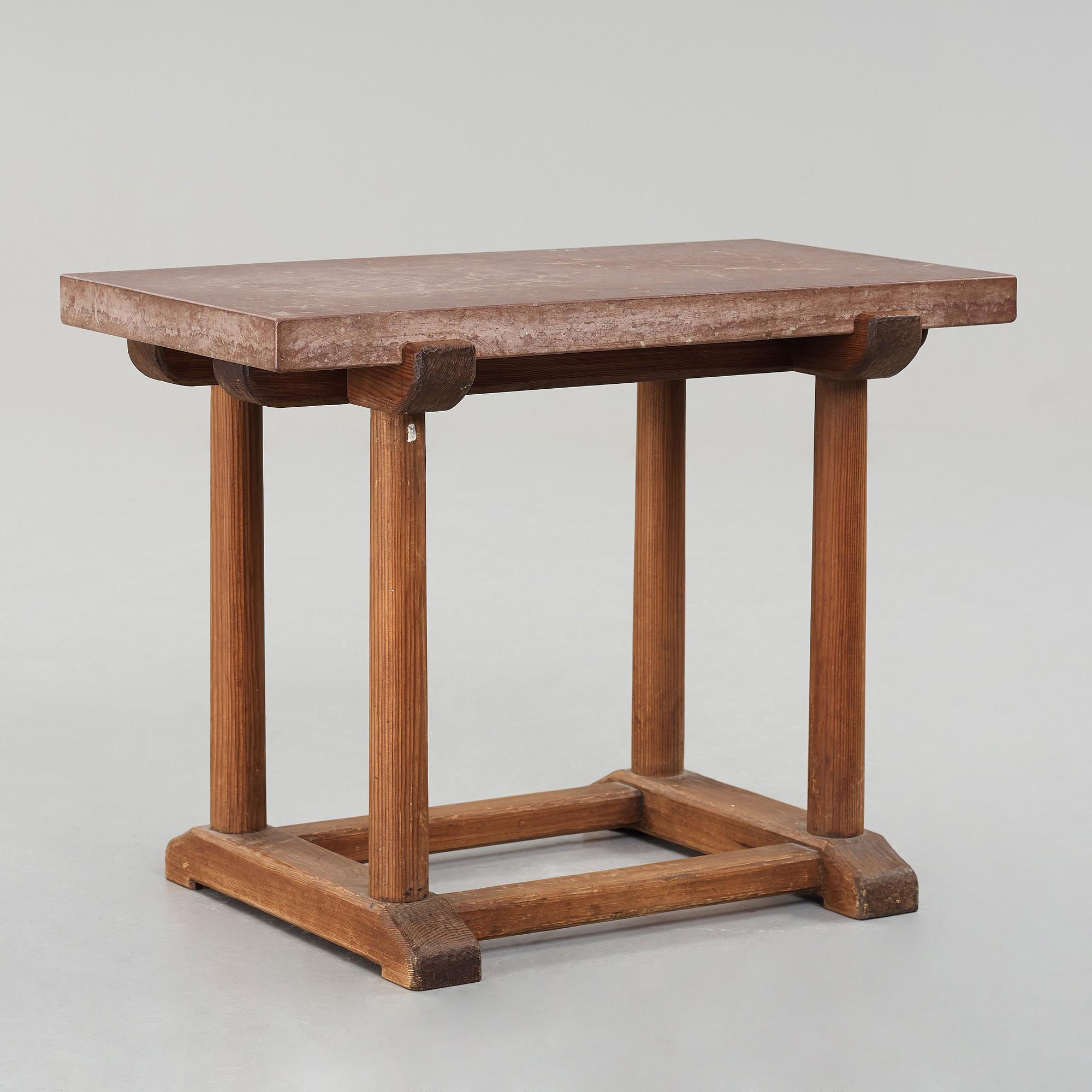 Axel Einar Hjorth, a red limestone top and stained pine side