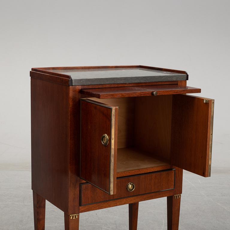 A pair of mahgany veneered bedside cabinets, early 20th Century.