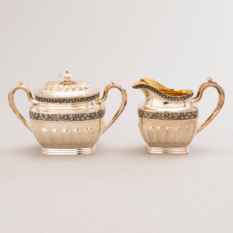 JUHO TEPPONEN, a lidded sugar bowl and a cream jug in silver with gilt interior, Helsinki 1936.