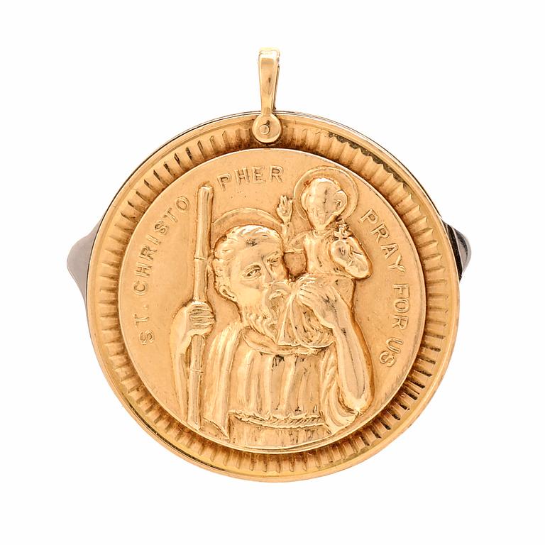 A 14K gold and steel medallion with knives.