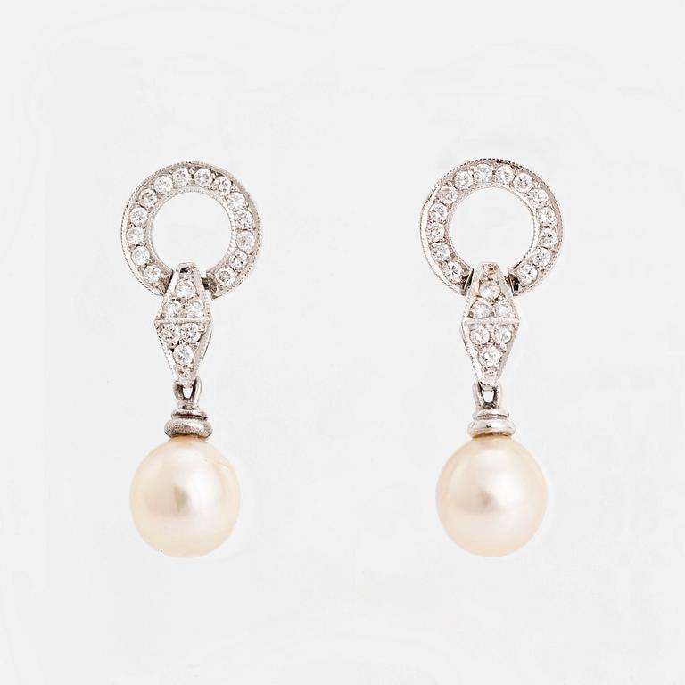 Pearl and brilliant cut diamond earrings.