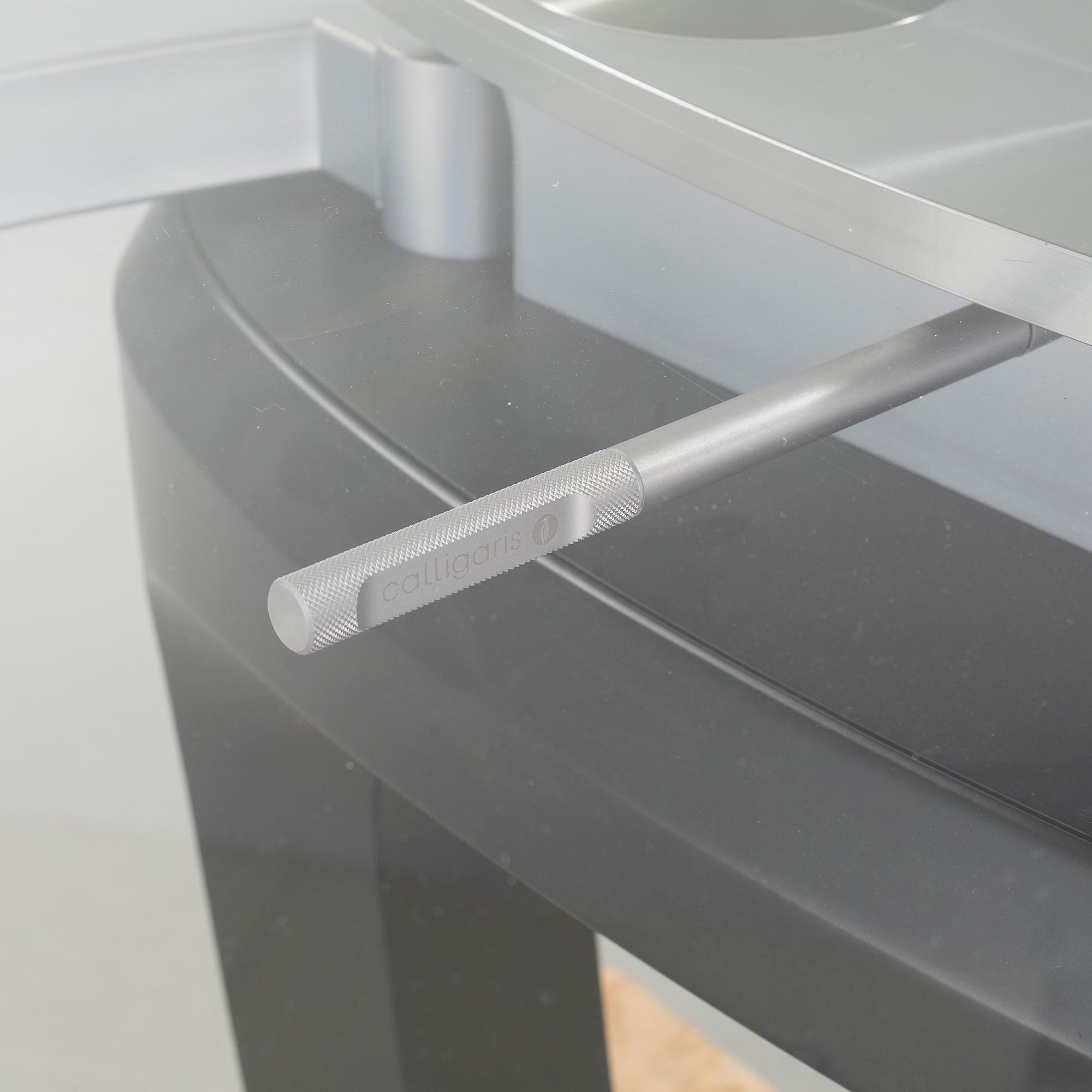 A 21st century "Orbital" dinner table by Pininfarina for Calligaris.