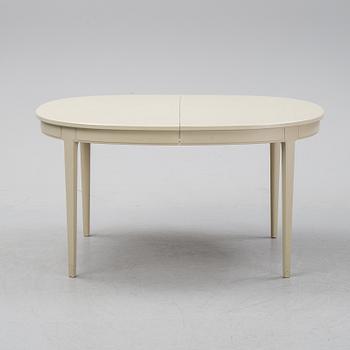 A dining table with six chairs by Carl Malmsten, second half of the 20th Century.