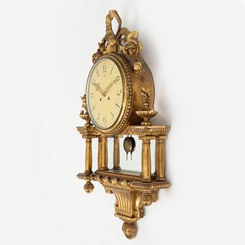 A  late Gustavian style wall clock, early 20th century.