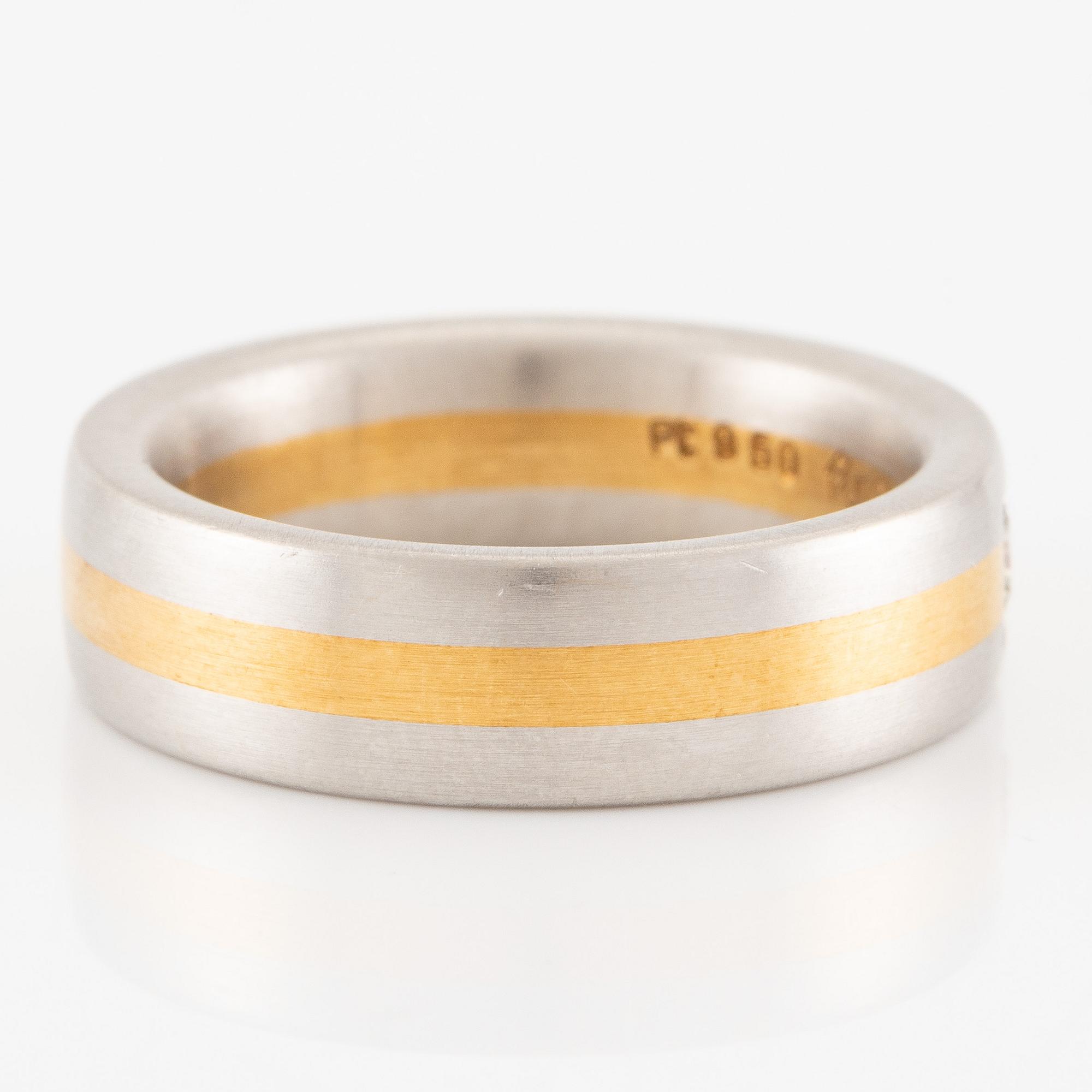 Ring in platinum and 18K gold set with a brilliant-cut diamond.