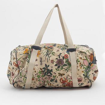 Gucci, a 'Flora' weekend bag and umbrella.