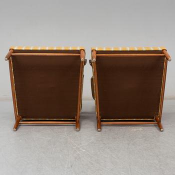 a pair of armchairs from the second half of the 20th century.